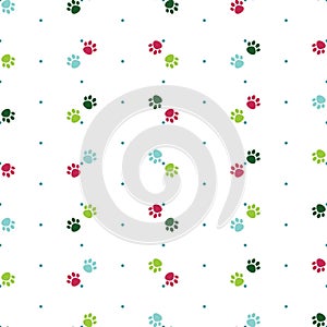 Vector seamless pattern with colorful cat paw dog paw. Pink, blue and green paws. Polka dot background