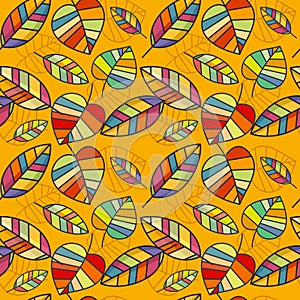 Vector seamless pattern with colorful leaves on a yellow background