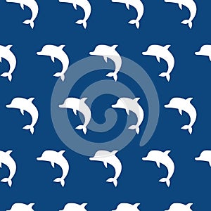 Vector seamless pattern with cute jumping dolphins white on blue background