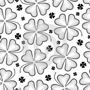 Vector seamless pattern with dotted lucky four leaf clover or shamrock in black on the white background. Holiday background.