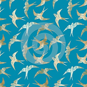 Vector seamless pattern with gold swallows on blue background