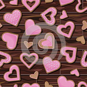 Vector seamless pattern of pink cookies in the shape of hearts isolated on background of wooden table