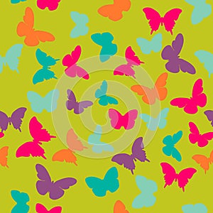 Vector seamless pattern with random orange, blue, pink, purple butterflies on green background