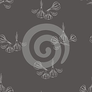 Vector seamless pattern of silhouette of the heads of garlic with sprouts on a gray background.