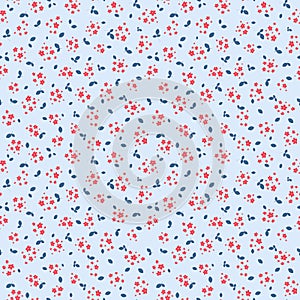 Vector seamless pattern with small pretty red flowers on blue. Ditsy texture