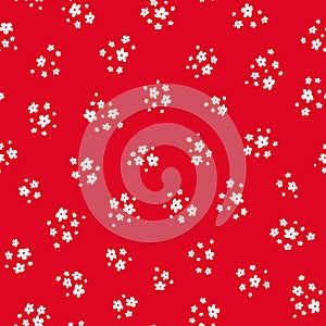 Vector seamless pattern with small pretty white flowers on red. Liberty style