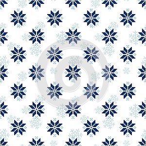 Vector seamless pattern for sweater with blue snowflakes.
