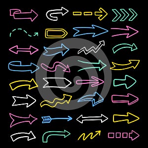 Vector set of colorful arrows. Hand-drawn, doodle elements isolated on black background.