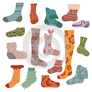 Vector set of flat hand drawn warm socks. Collection of knitted clothes with decoration for stickers. Stockings and golfs photo