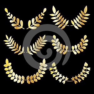 Vector set of golden design floral laurels isolated on black background.