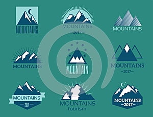 Vector set of mountain exploration vintage emblems and rock silhouette design elements