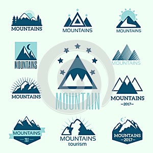 Vector set of mountain exploration vintage emblems and rock silhouette design elements