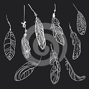 Vector set of stylized bird feathers. Collection of feathers for decoration. Black and white drawing by hand. Linear Art