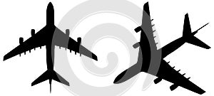 Vector set of two flying black passenger jetliner or commercial planes, isolated on white background as a metaphor for