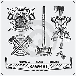 Vector set of vintage Lumberjack logos, labels and emblems. Axes and saws. photo