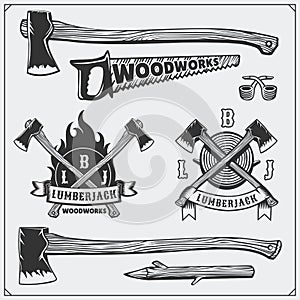 Vector set of vintage Lumberjack logos, labels, emblems and design elements. Axes and saws. photo