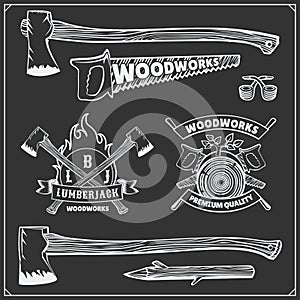 Vector set of vintage Lumberjack logos, labels, emblems and design elements. Axes and saws. photo