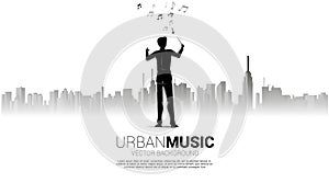 Vector silhouette of conductor standing with city background.