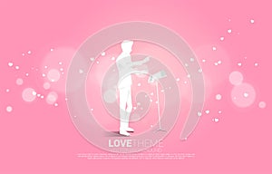 Vector silhouette of conductor standing with heart flying .