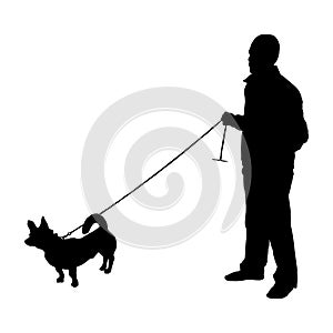 Vector silhouette of a man with a dog on a white background.