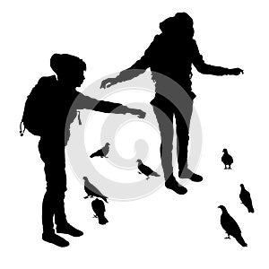 Vector silhouettes of a young girl in two versions feeding pigeons. Birds silhouettes isolated on white