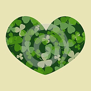 Vector St Patrick's day card. Green clover leaves on clover heart shape and white or beige background