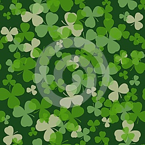 Vector St Patrick's day seamless pattern. Green and white clover leaves on dark background.