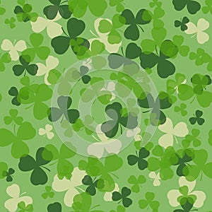 Vector St Patrick's day seamless pattern. Green and white clover leaves on green background