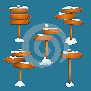 Vector winter, late autumn holidays elements. Snow covered wooden signposts with arrow shaped planks.