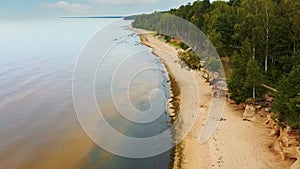 Veczemju Cliffs Red Rocks, Latvia. Red Sandstone Cliff by the Baltic Sea Coast of Vidzeme