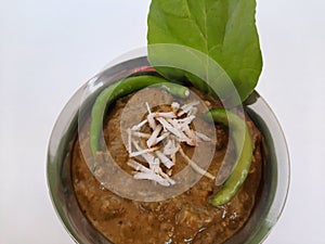 Veg. Hyderabadi curry on a plain white background