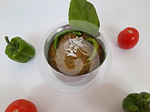 Veg. Hyderabadi curry on a plain white background