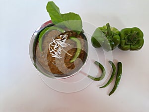 Veg. Hyderabadi curry on a plain white background