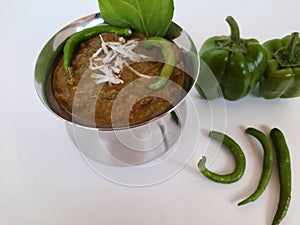 Veg. Hyderabadi curry on a plain white background