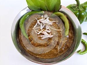 Veg. Hyderabadi curry on a plain white background