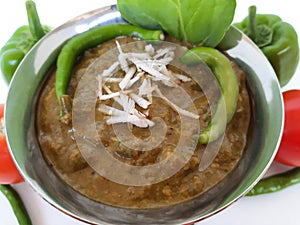 Veg. Hyderabadi curry on a plain white background