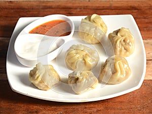 Veg steam momo. Nepalese Traditional dish Momo stuffed with vegetables and then cooked and served with sauce and mayonnaise over a