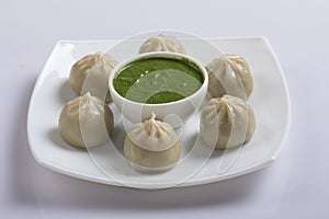 Veg steam momo. Nepalese Traditional dish Momo stuffed with vegetables and then cooked and served with sauce over a rustic wooden