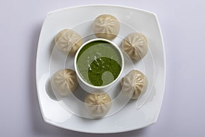 Veg steam momo. Nepalese Traditional dish Momo stuffed with vegetables and then cooked and served with sauce over a rustic wooden