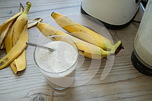Vegan banana smoothie at the kitchen on the table
