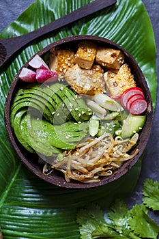 vegan bowl with avocado, bean sprouts and tofu