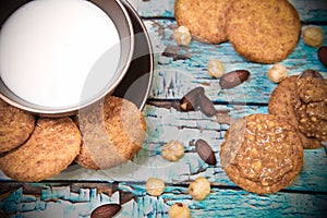 Vegan breafast with peanut butter, almond milk, whole grain cookies, hazelnuts