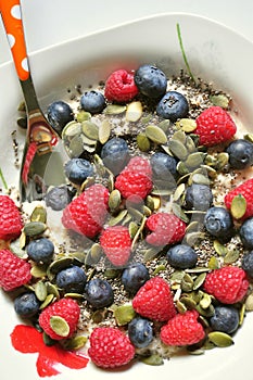 Vegan breakfast with berries and chia, pumpkin seeds