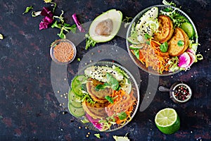 Vegan buddha bowl dinner food table. Healthy food. Healthy vegan lunch bowl. Fritter with lentils and radish, avocado, carrot sala