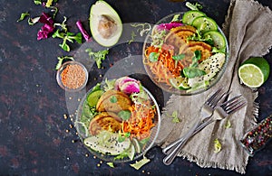 Vegan buddha bowl dinner food table. Healthy food. Healthy vegan lunch bowl. Fritter with lentils and radish, avocado, carrot sala