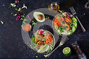 Vegan buddha bowl dinner food table. Healthy food. Healthy vegan lunch bowl. Fritter with lentils and radish, avocado, carrot sala