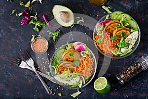 Vegan buddha bowl dinner food table. Healthy food. Healthy vegan lunch bowl. Fritter with lentils and radish, avocado, carrot sala