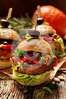 Vegan burgers, Pumpkin burgers with the addition of grilled peppers, lettuce, fresh herbs and capers