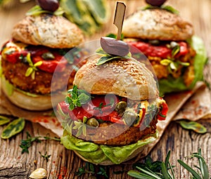 Vegan burgers, Pumpkin burgers with the addition of grilled peppers, lettuce, fresh herbs and capers