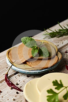 Vegan cheese and tofu cold cuts on a table